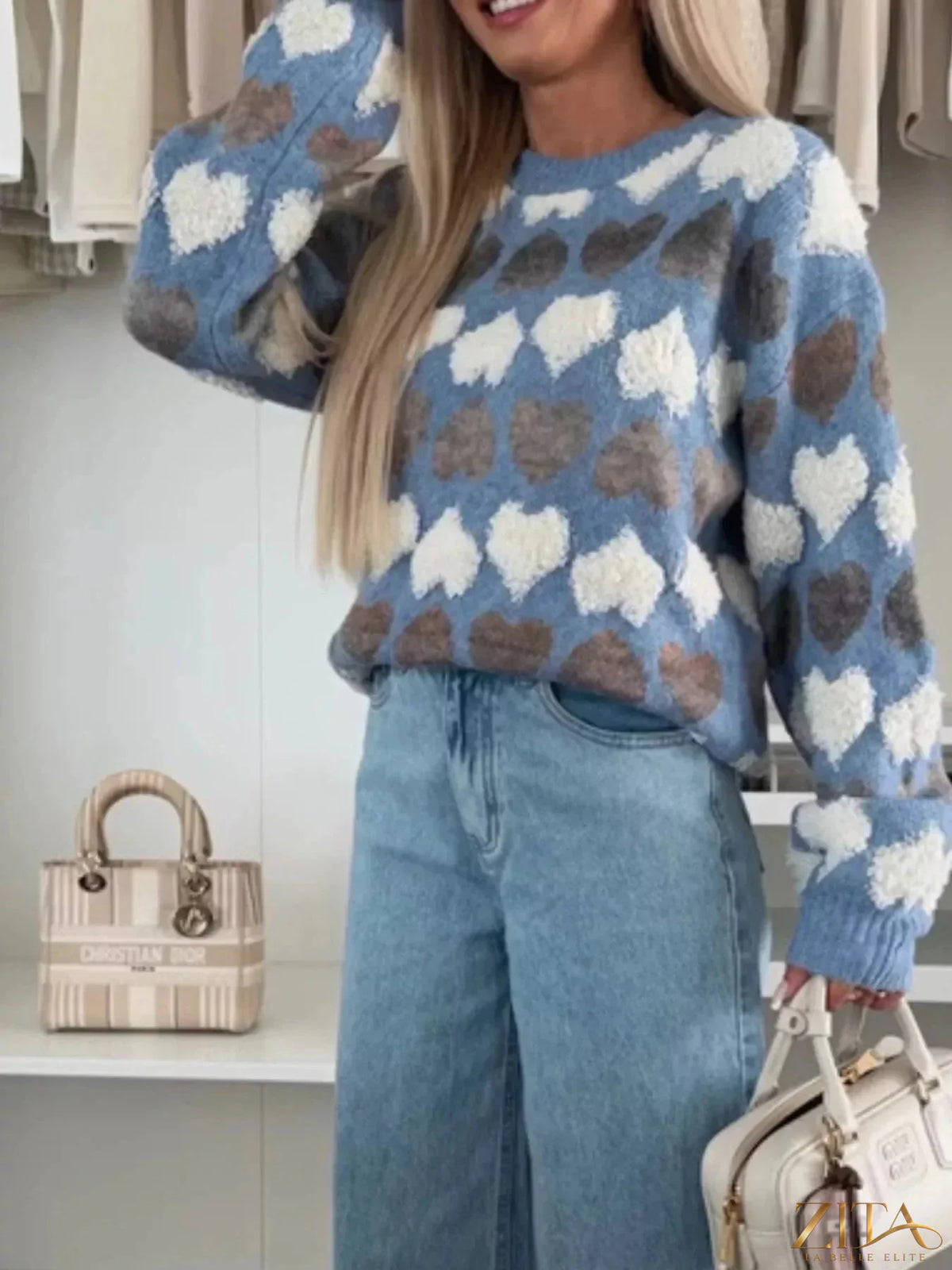 Heart-patterned round neck sweater by Zita La Belle Elite, featuring a cozy knit with red and pink heart designs on a soft fabric.