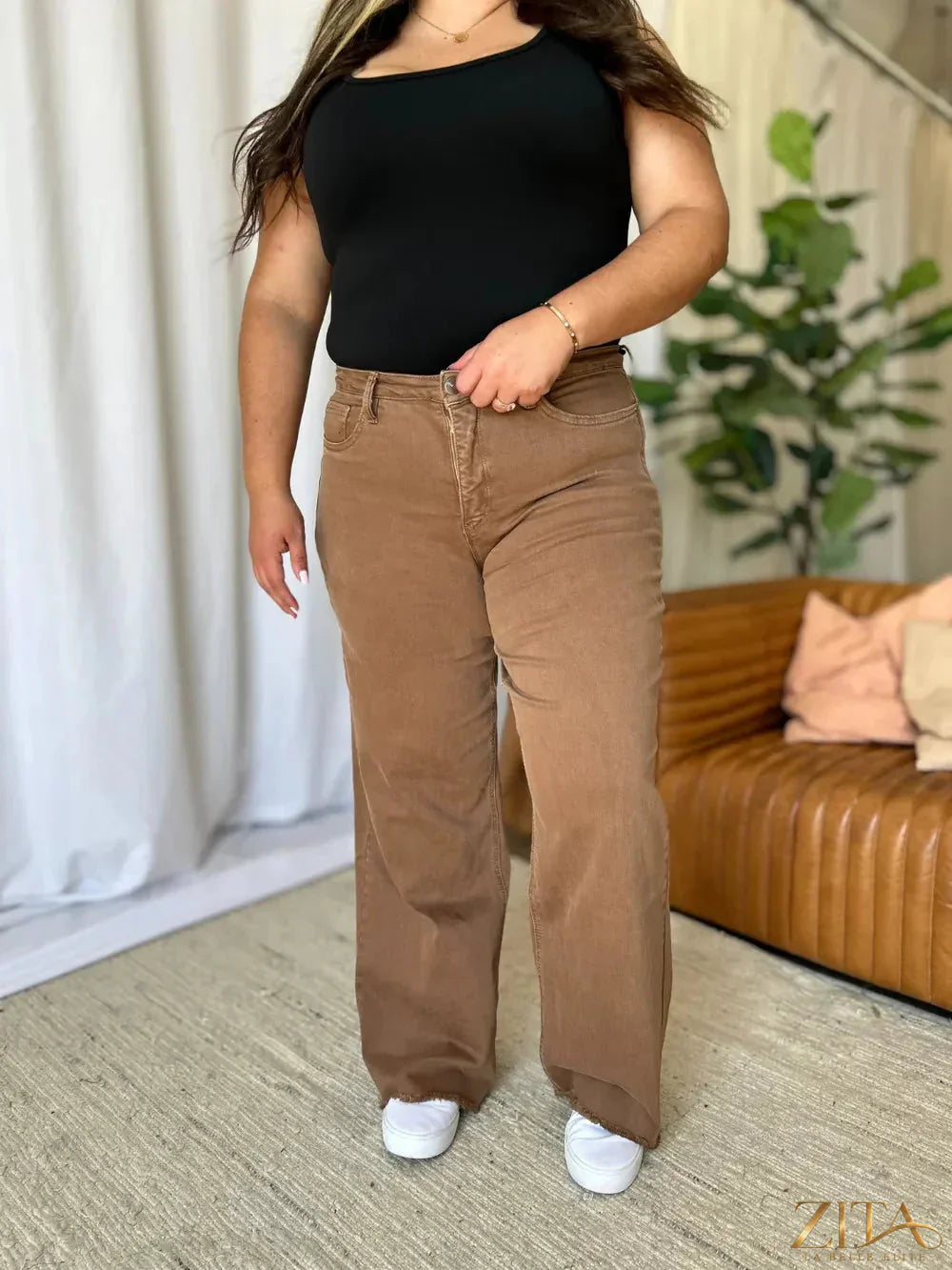 Zita La Belle Elite RFM full size high rise garment dye wide leg jeans hanging on a rack.