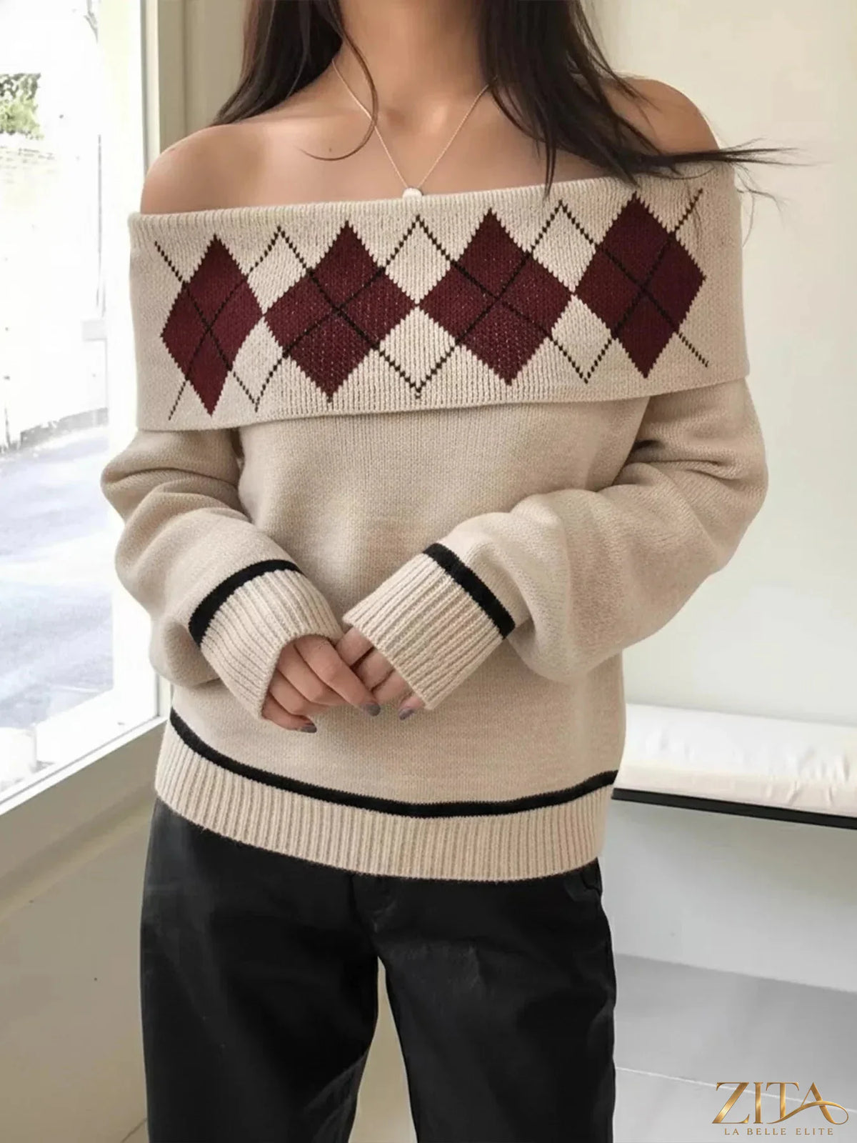 Off-shoulder argyle pattern sweater by Trendsi featuring a cozy knit design and classic diamond pattern in soft colors.