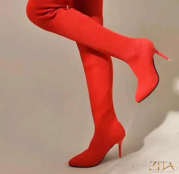 Point toe stiletto boots by Trendsi featuring sleek black leather, high heels, and a modern, stylish design.
