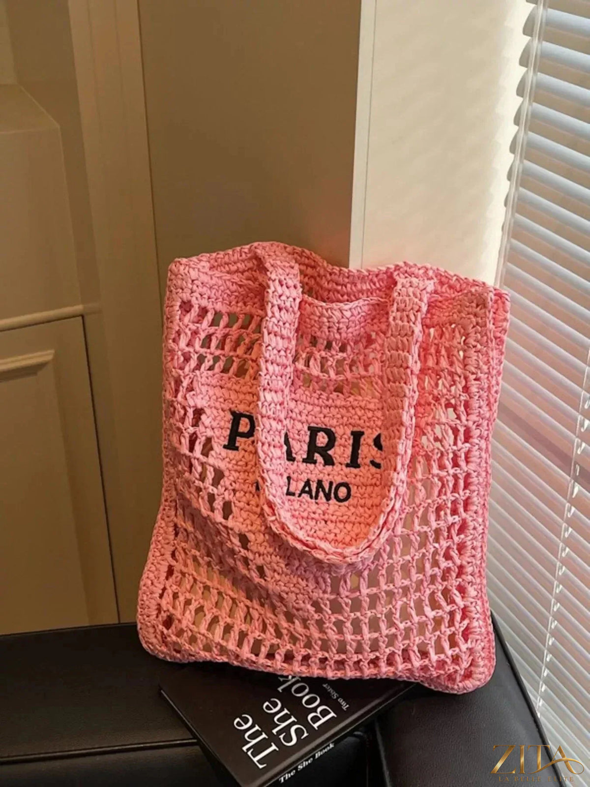 Crochet knit shoulder bag by Zita La Belle Elite featuring a textured, stylish design with a shoulder strap and intricate craftsmanship.