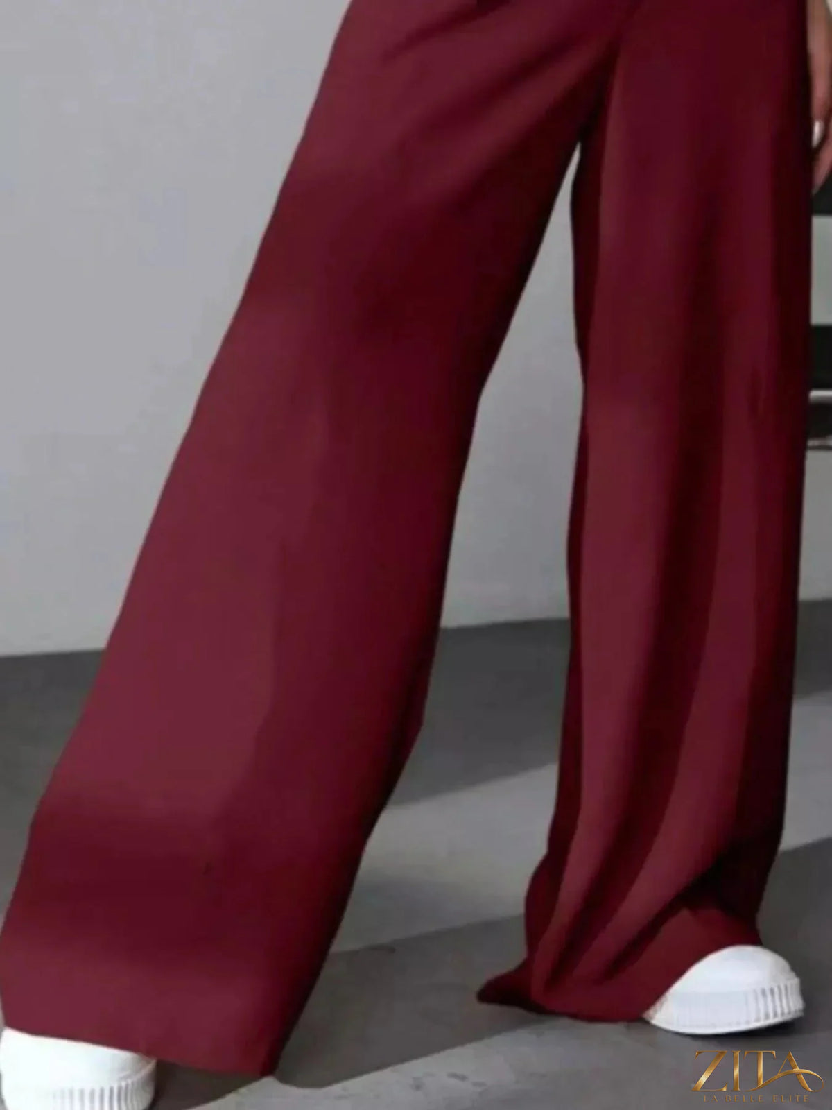 Zita La Belle Elite wide leg pleated pants in a flowing fabric, featuring a high-rise waist and relaxed fit.