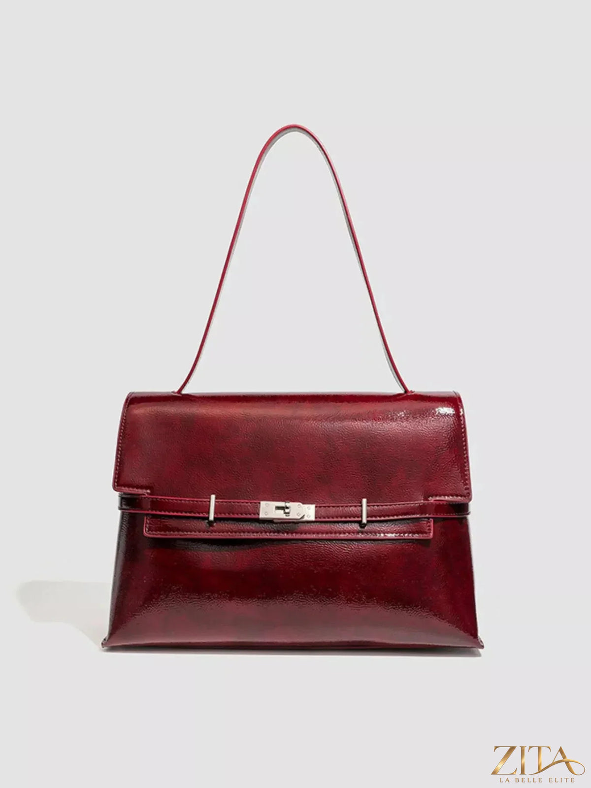 Zita La Belle Elite buckle leather shoulder bag with adjustable strap and sleek design, featuring a decorative front buckle detail.