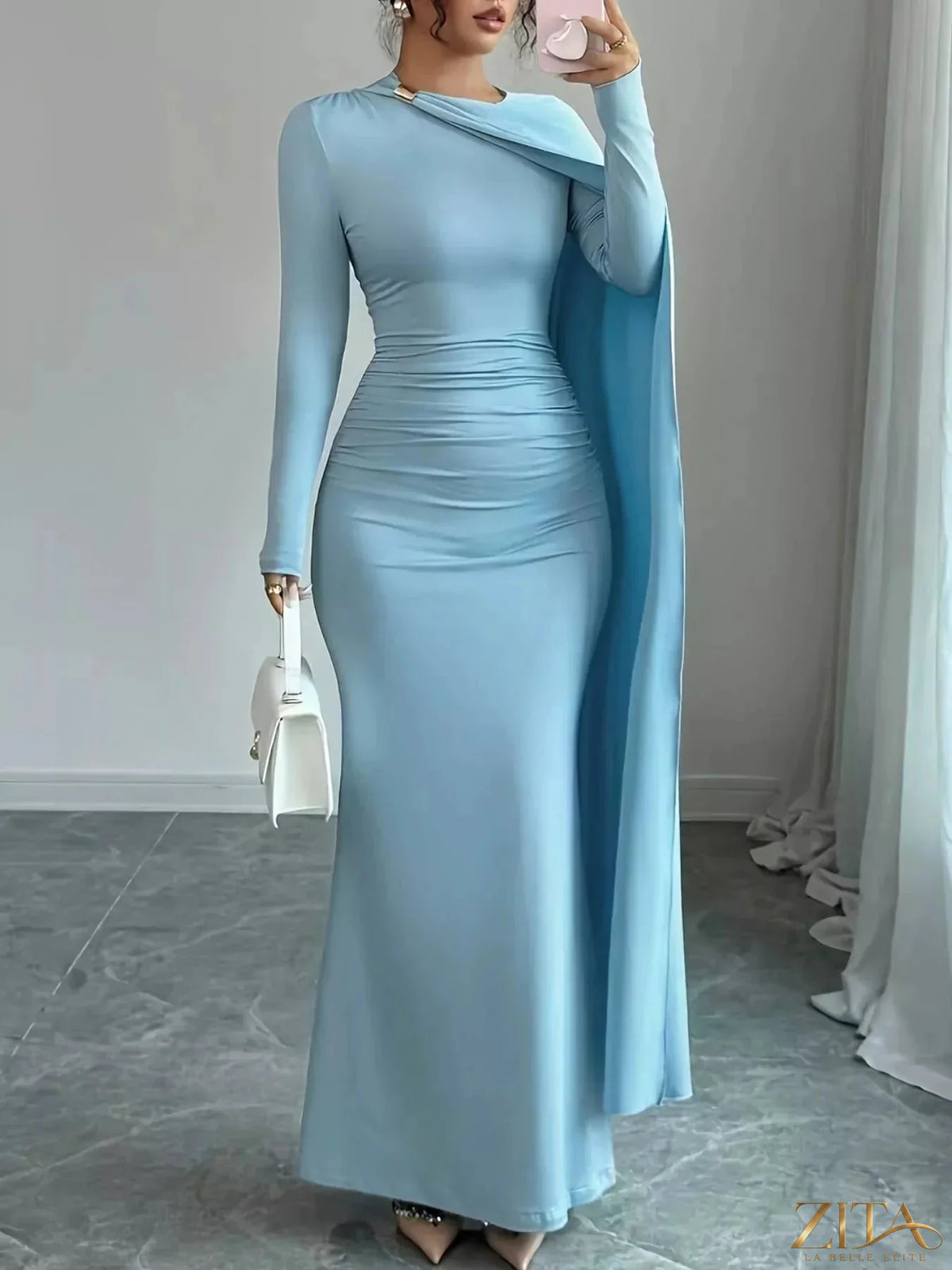 Zita La Belle Elite ruched long sleeve maxi dress in flowing fabric with a fitted bodice and elegant design.