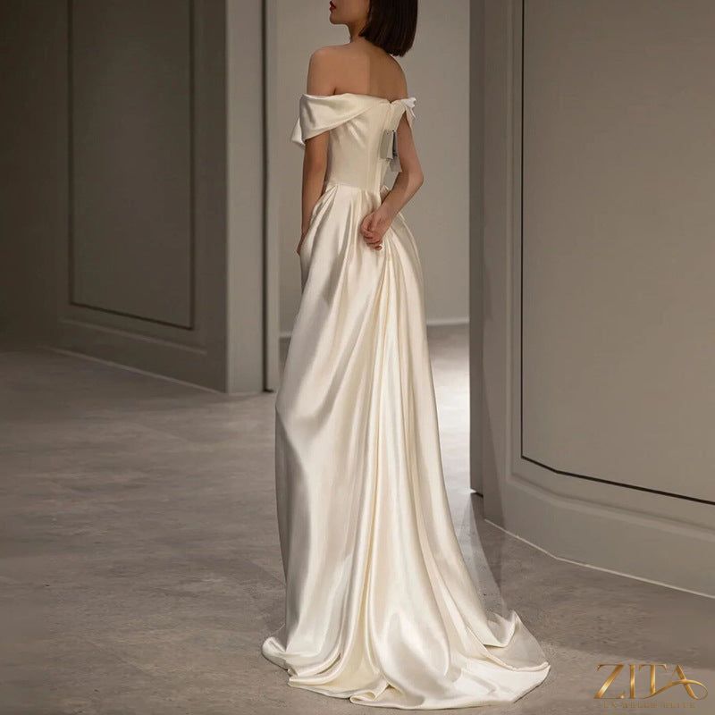 Elegant French white off-shoulder wedding dress for women by Zita La Belle Elite, featuring a light, flowing design.