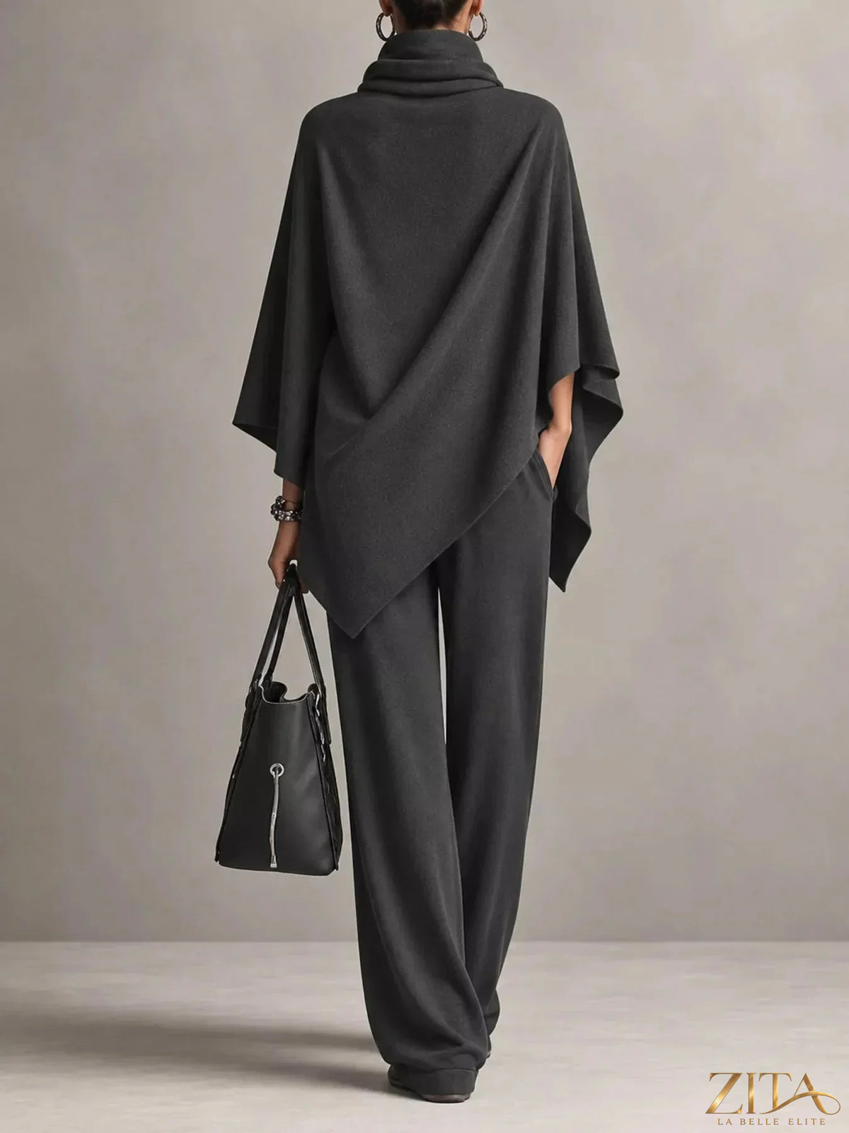 Plus size turtleneck poncho and wide-leg pants set by Trendsi, featuring a cozy, stylish knit look and relaxed fit.