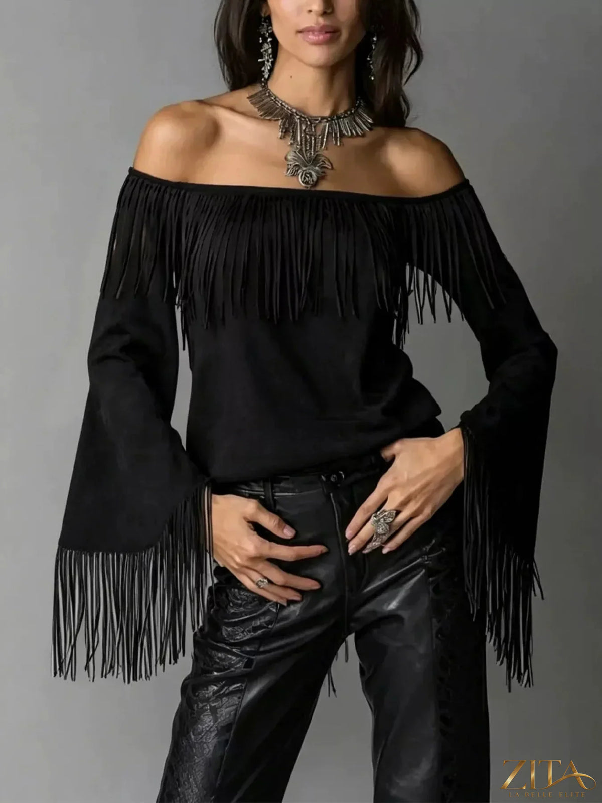 Plus size fringed off-shoulder T-shirt by Trendsi, featuring a relaxed fit and stylish fringe detail on the shoulders.