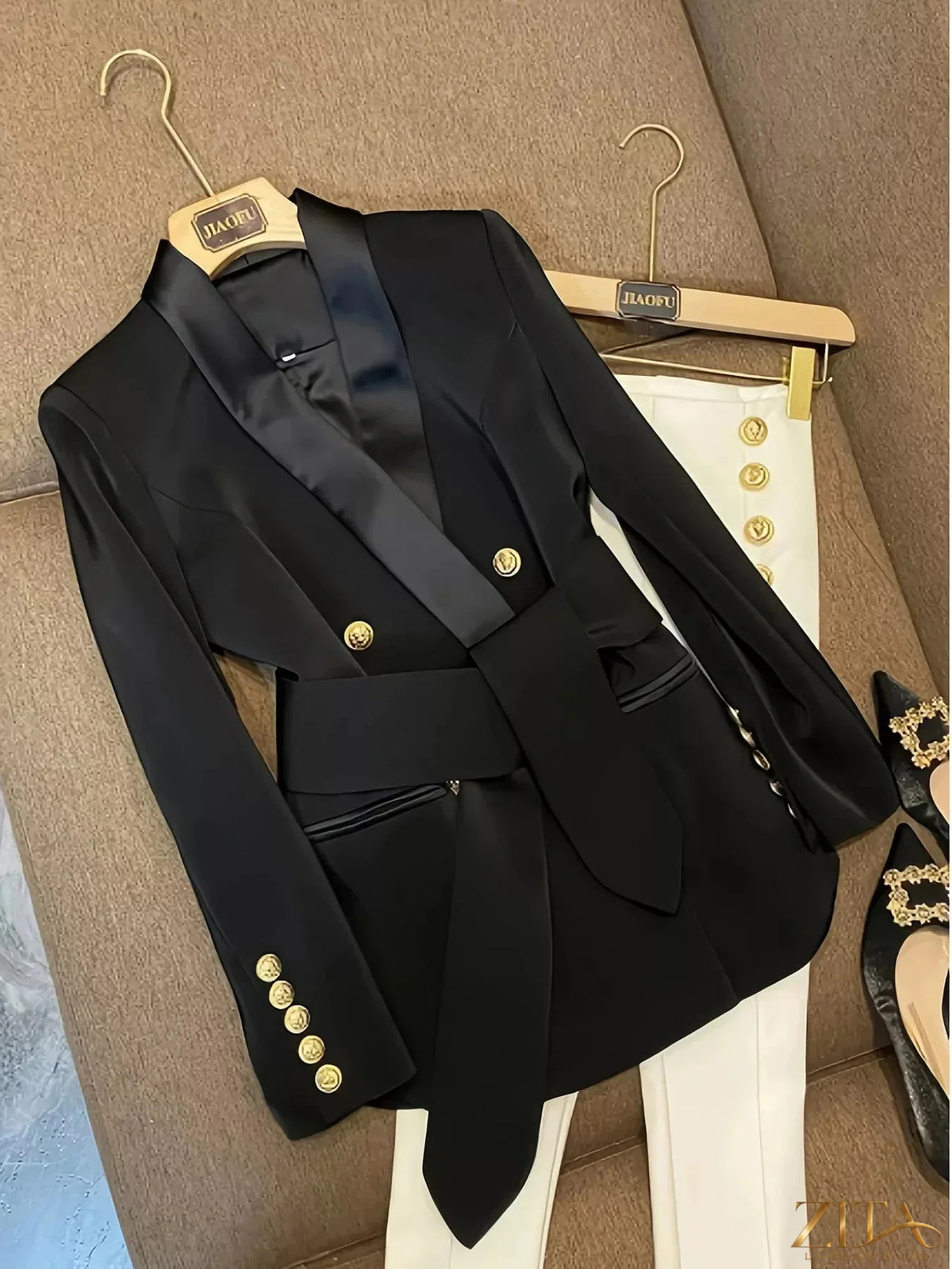 Slim fit double-breasted blazer by Trendsi featuring a tailored design, notched lapels, and stylish button details.
