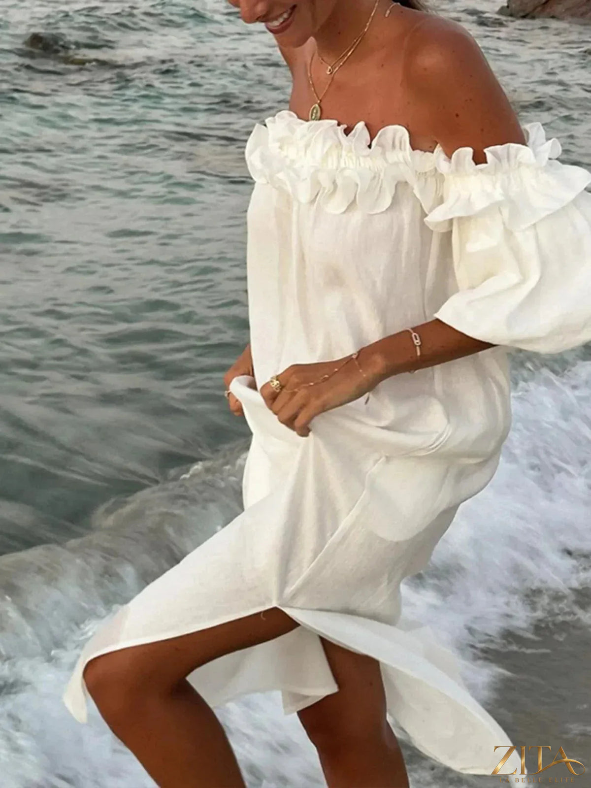 Zita La Belle Elite side slit off-shoulder dress in lightweight fabric, featuring a flowing silhouette and elegant design.