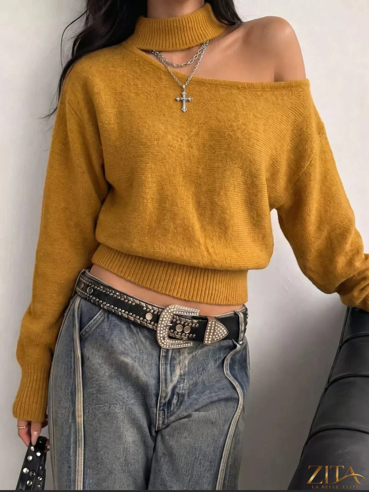 Cold-shoulder dropped shoulder sweater by Trendsi featuring a cozy knit fabric and stylish cut-out shoulders.