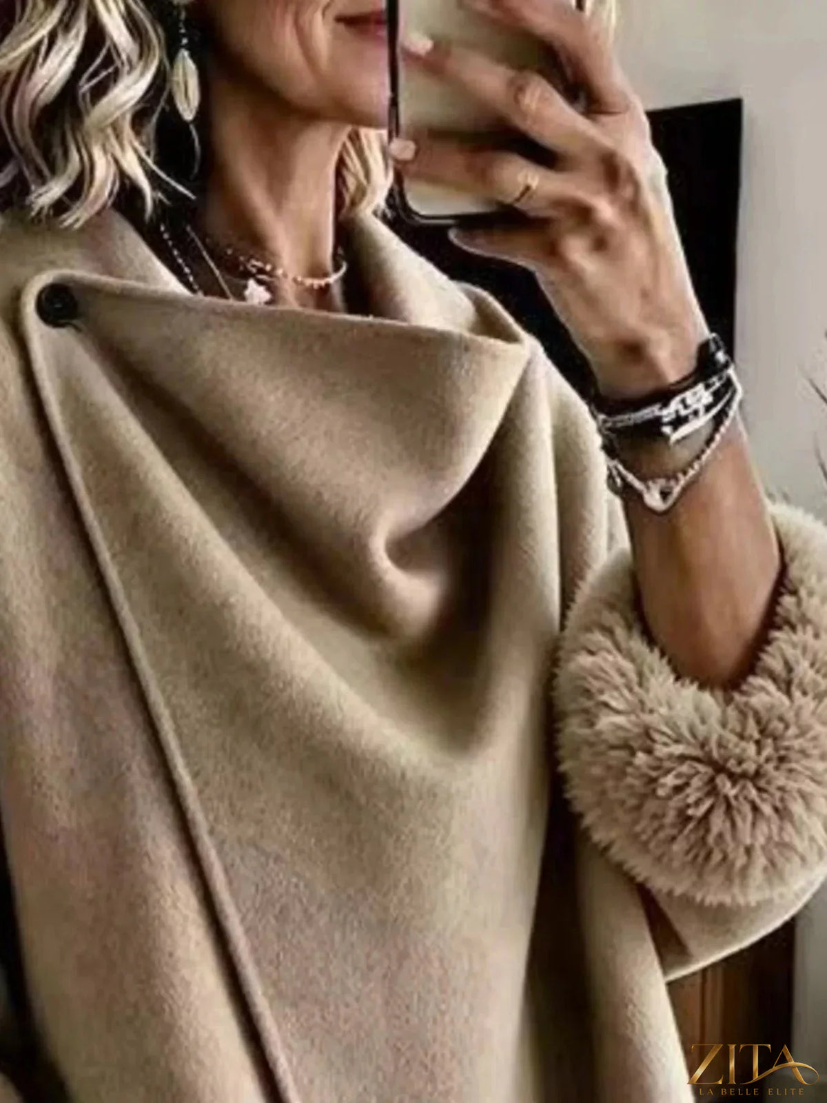 Plus size full-length outerwear by Zita La Belle Elite featuring elegant asymmetric faux fur cuffs and stylish design.