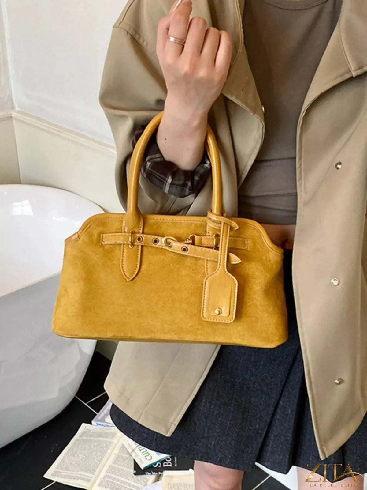 Vintage Zita La Belle Elite handbag with buckle detail, featuring a classic design and textured leather finish.
