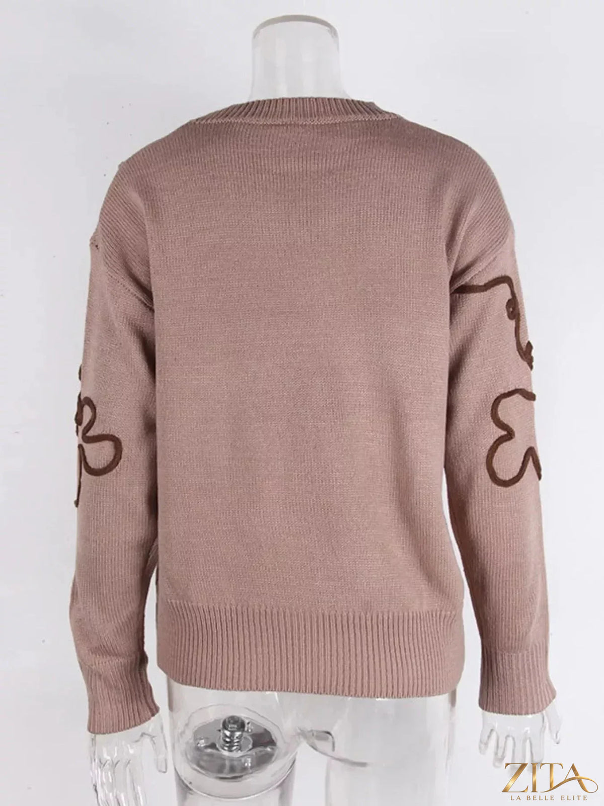 Flower dropped shoulder sweater by Trendsi featuring a floral design and relaxed fit, shown on a model with long sleeves.