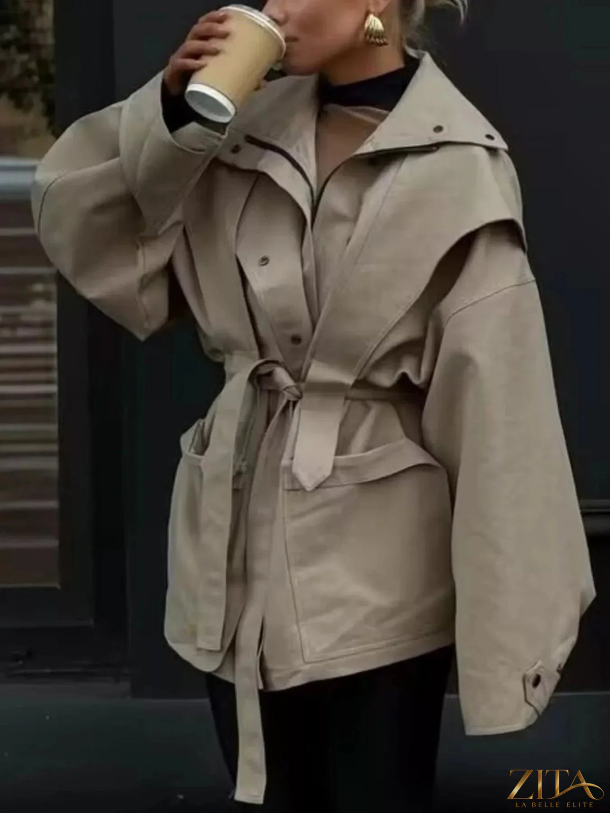 Zita La Belle Elite tie waist snap-down trench coat featuring a classic design with a belt and button details on the front.