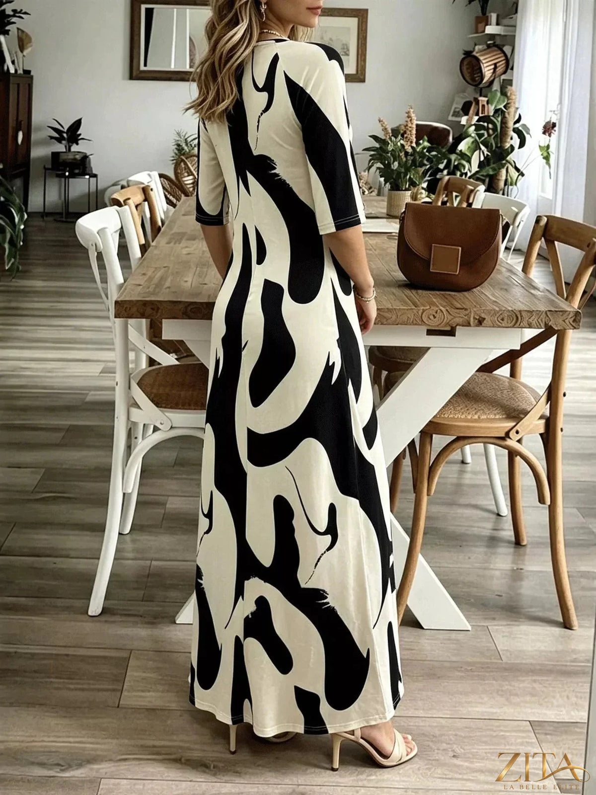 Abstract print casual maxi dress by Zita La Belle Elite, featuring a flowing silhouette and vibrant, artistic design.