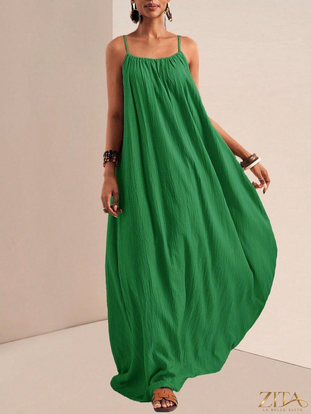 Flowy maxi dress with spaghetti straps by Zita La Belle Elite, featuring a lightweight, breezy design perfect for warm weather.