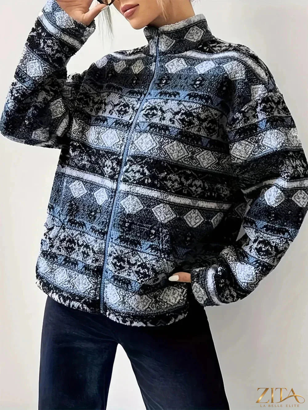 Zita La Belle Elite geometric turtleneck zip-up jacket featuring bold patterns and a fitted design.