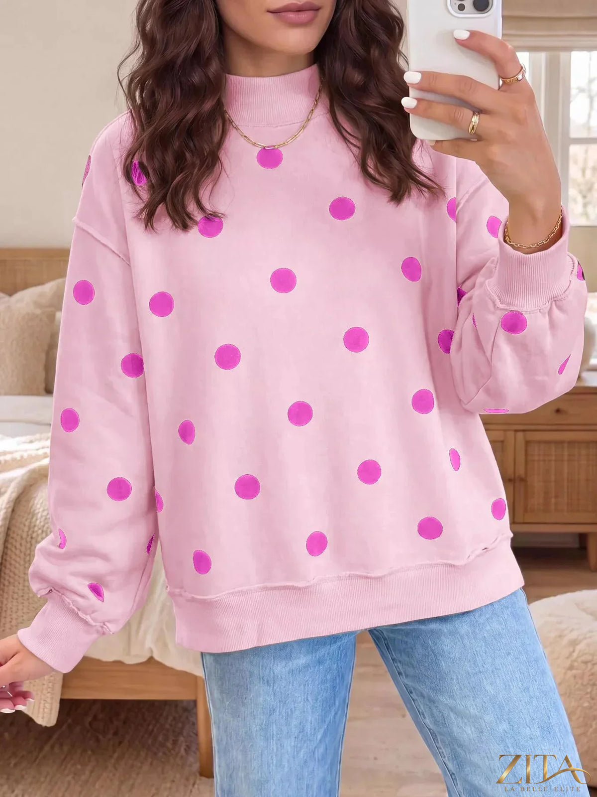 Zita La Belle Elite polka dot mock neck oversized sweatshirt in black and white, featuring a relaxed fit and long sleeves.