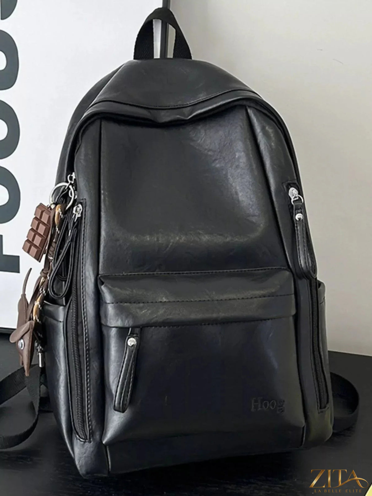 Leather texture backpack bag with adjustable straps and front pocket, stylish Trendsi accessory for casual or everyday use.