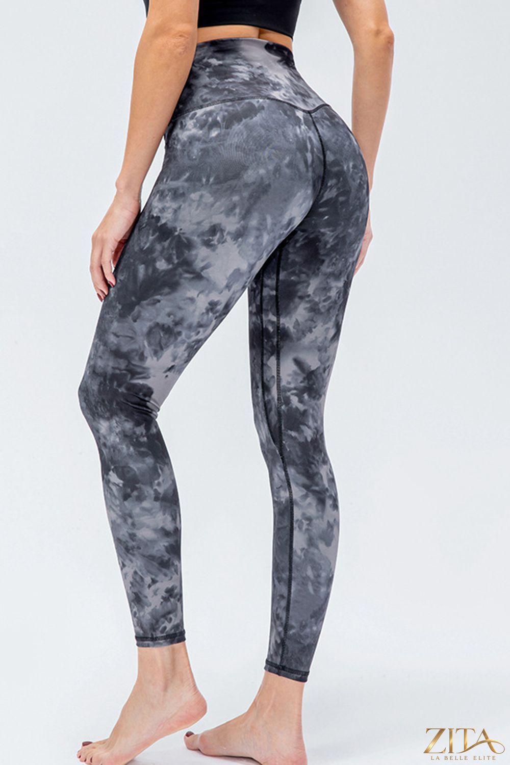 Black wide waistband slim fit active leggings by Trendsi, featuring a comfortable stretch fabric and sleek design.