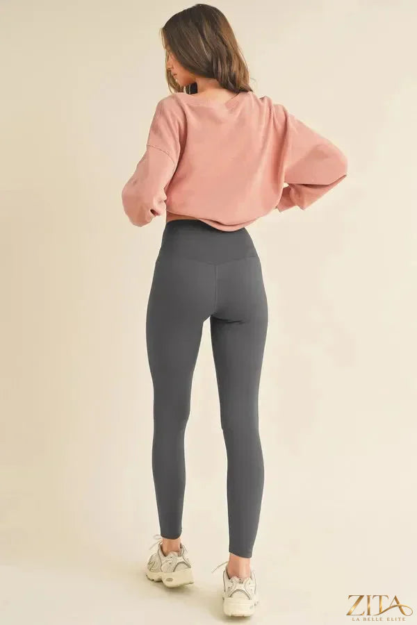 Yelete fleece-lined high-waisted leggings, full size, cozy and warm, showing the soft fleece interior and sleek black exterior.