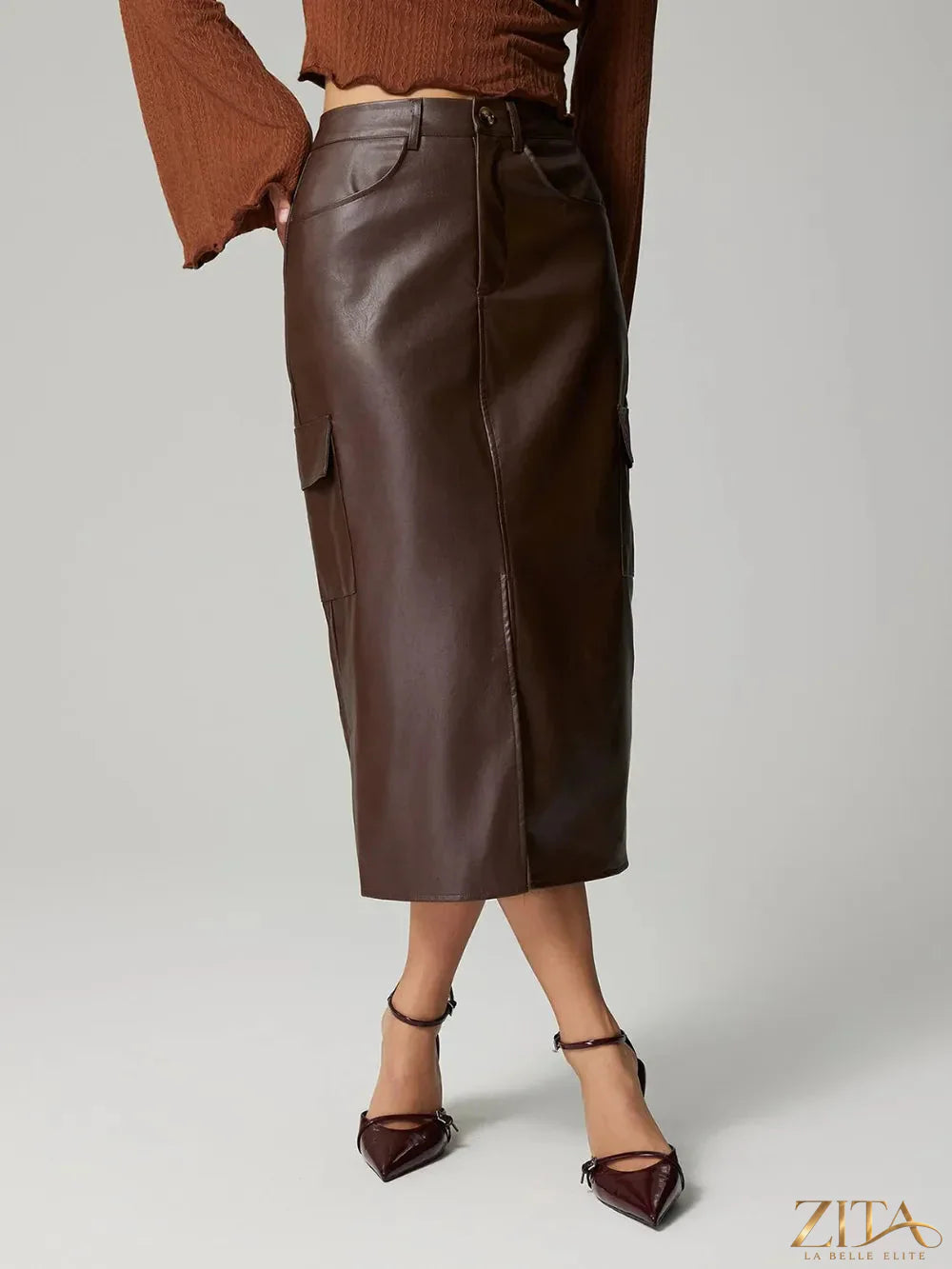Trendsi slit midi skirt with pockets, featuring a flowy design and high waist, shown in black fabric.