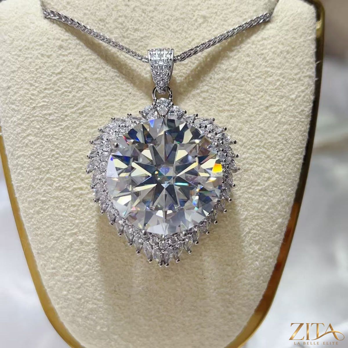 Sterling silver pendant necklace with 20 carat moissanite gemstone, elegant jewelry piece with a sparkling center stone.