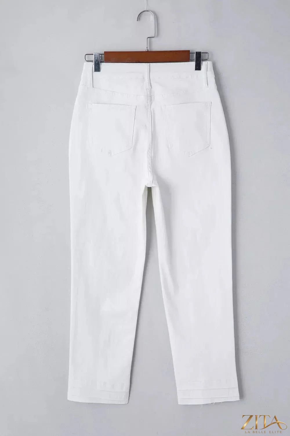 High-waisted straight-leg jeans by Zita La Belle Elite, shown on a model, in classic denim with front pockets and belt loops.