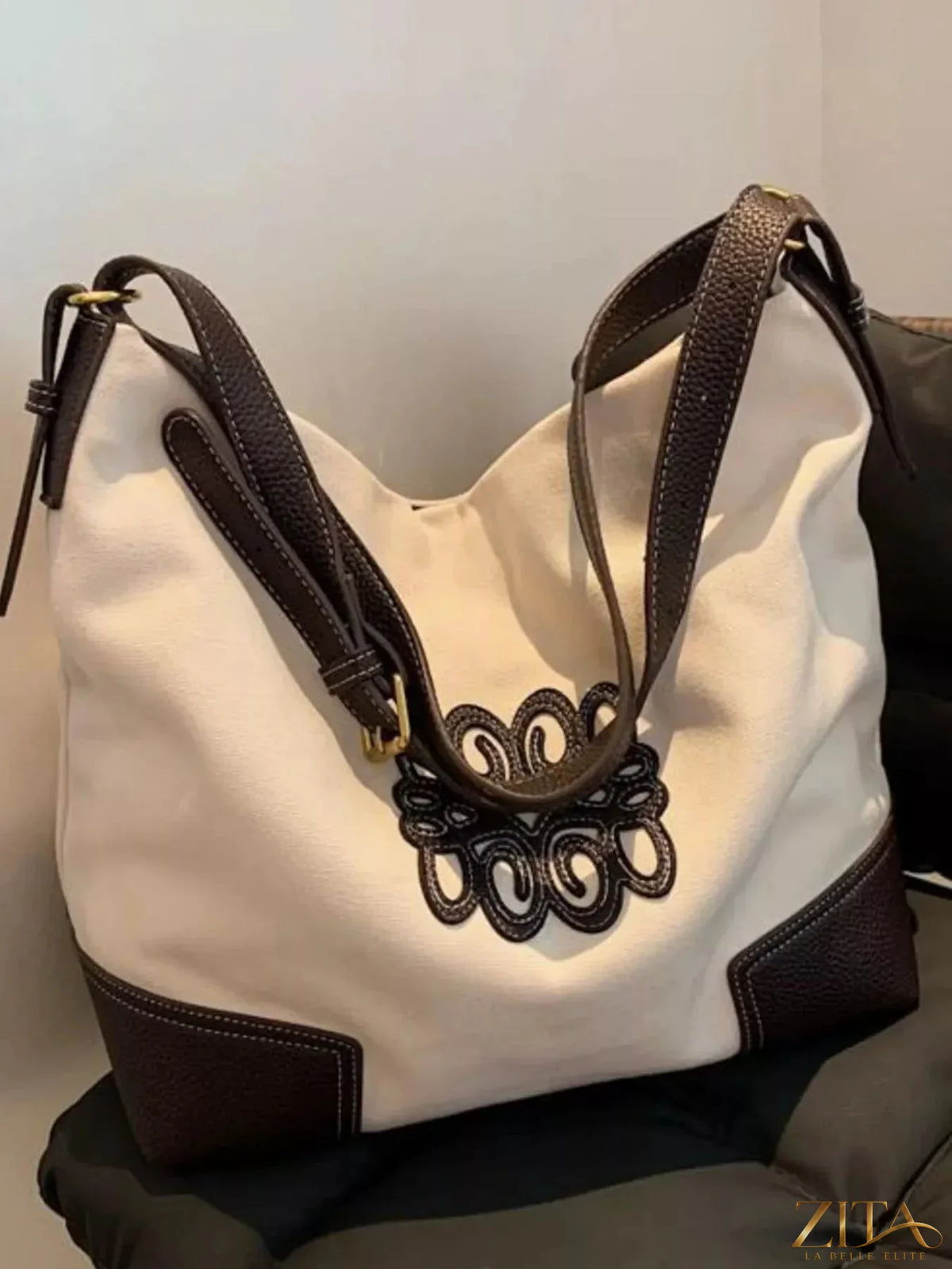 Embroidered canvas tote bag by Zita La Belle Elite featuring colorful floral embroidery and sturdy handles.