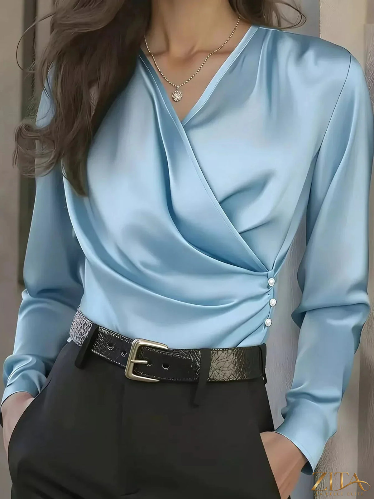 Zita La Belle Elite satin surplice long sleeve blouse in soft, shiny fabric with elegant draping and a V-neck design.