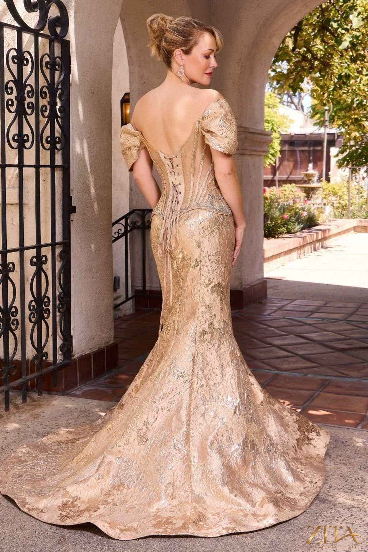 Gold couture-inspired off shoulder fitted mermaid gown by Zita La Belle Elite, showcasing elegant back design and figure-flattering silhouette.