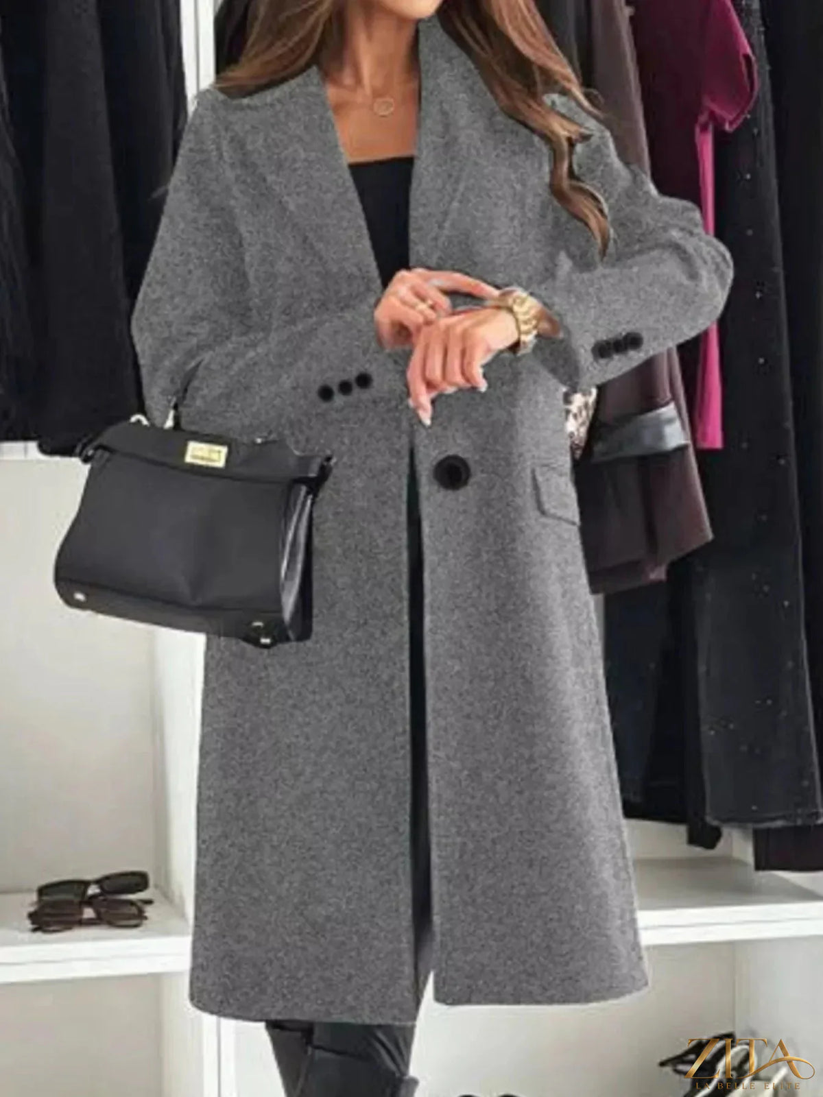 Zita La Belle Elite lapel collar long sleeve coat shown hanging with front view, stylish outerwear with tailored design and classic lapel.