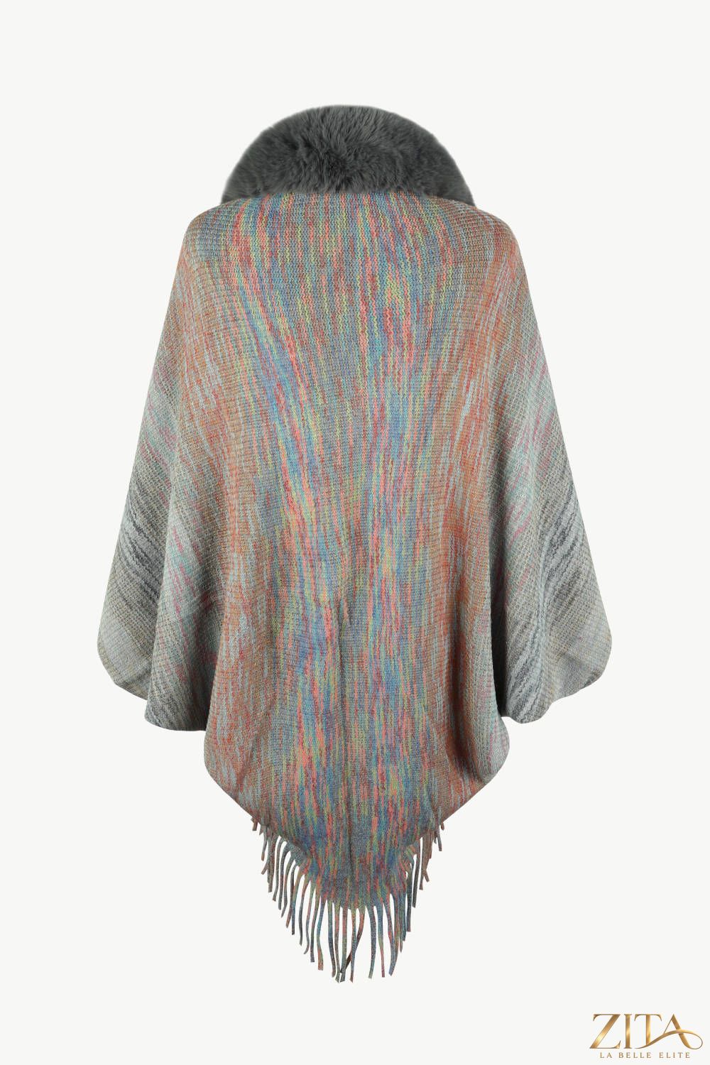 Open front fringe hem poncho from Trendsi featuring a flowing design and fringe details on the hem.