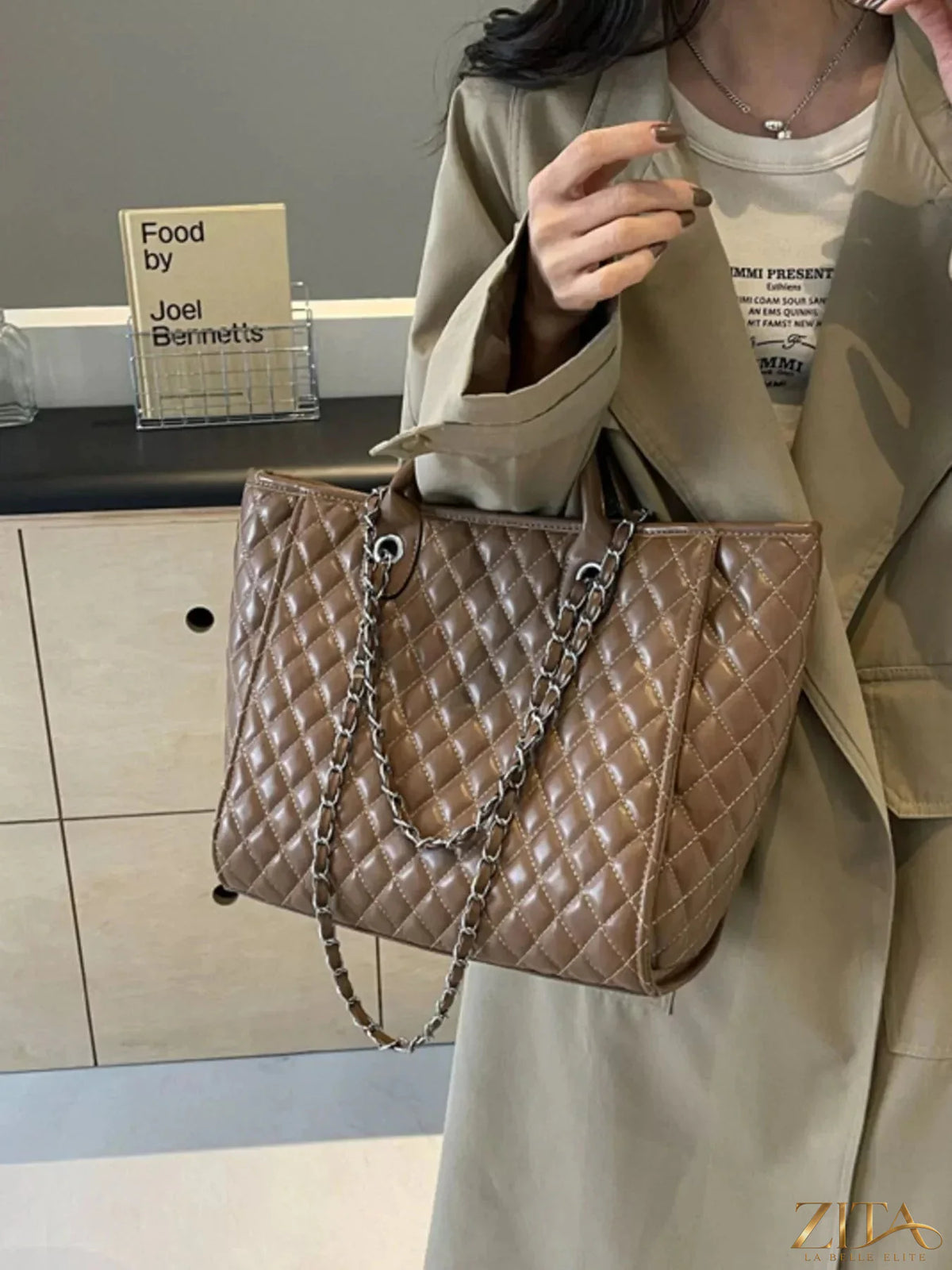 Zita La Belle Elite quilted chain shoulder bag with gold-tone hardware and adjustable strap, showcasing its elegant design.
