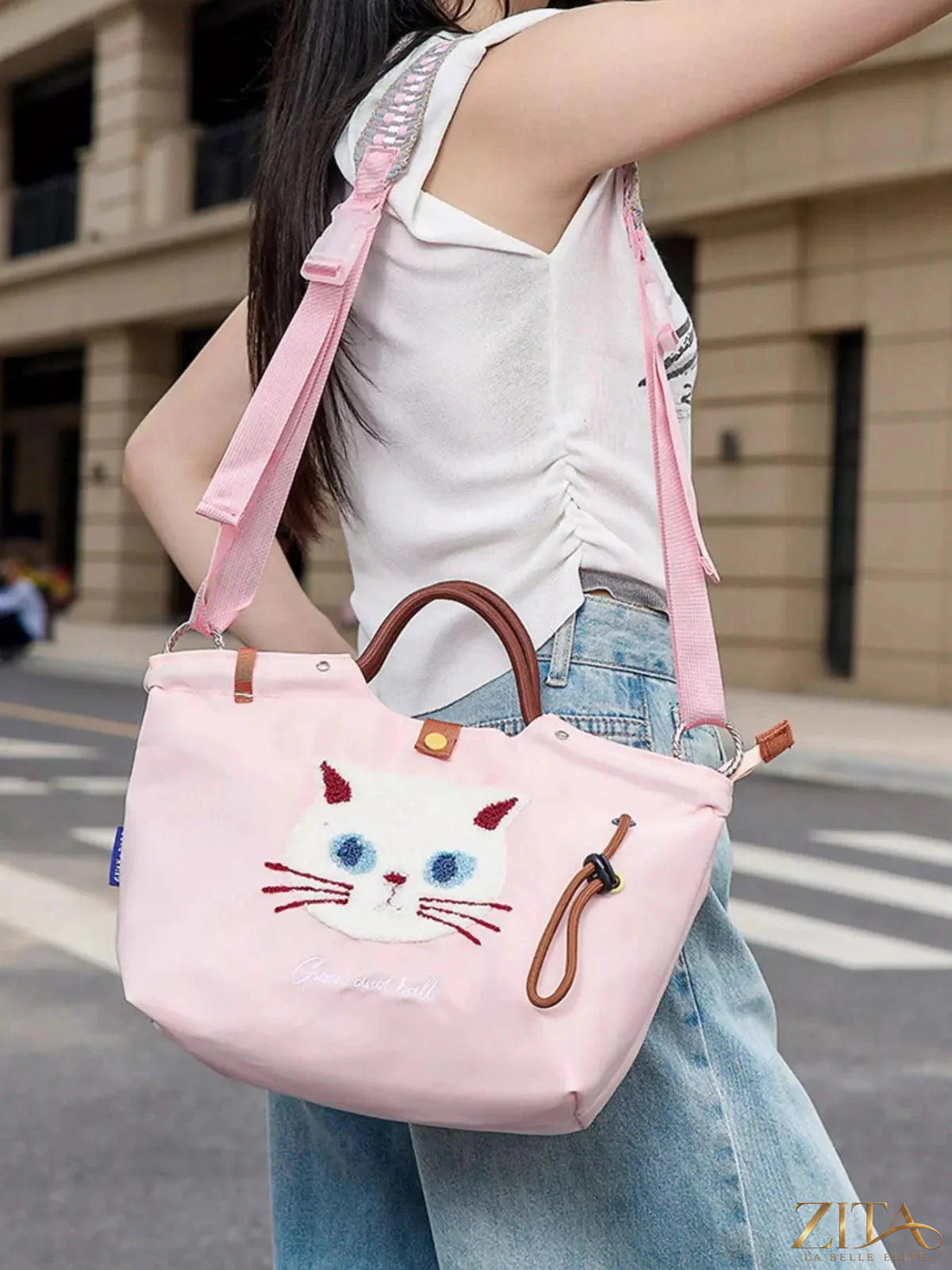 Embroidered cat tote bag by Zita La Belle Elite featuring adjustable shoulder strap and detailed feline embroidery on fabric.