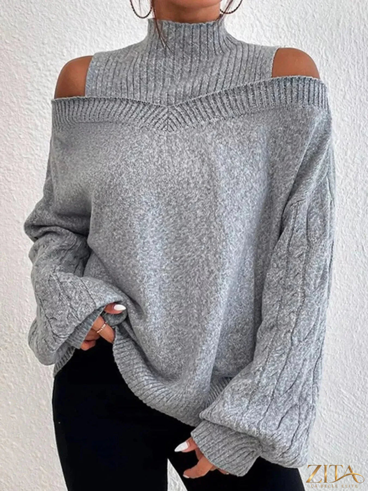 Zita La Belle Elite cold shoulder turtleneck sweater in soft knit with open shoulder design and fitted silhouette.