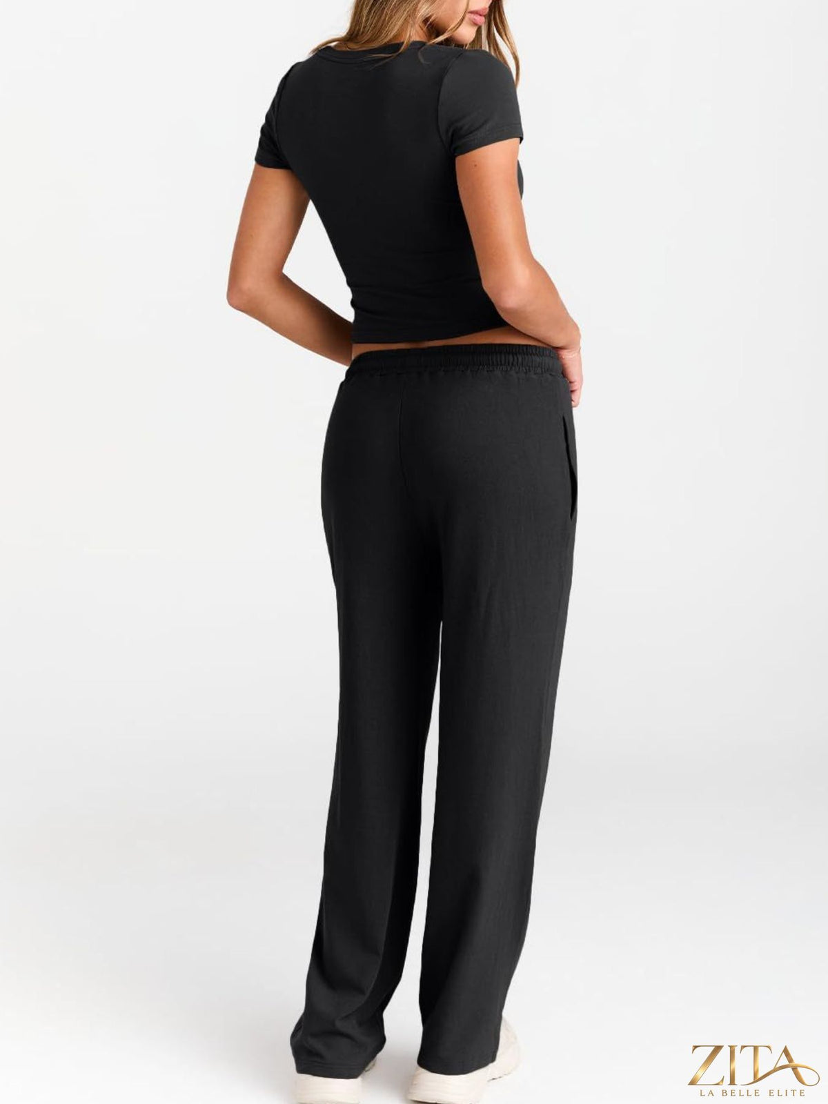 Trendsi round neck short sleeve tee and matching pants set, casual apparel for comfortable everyday wear, shown in a relaxed fit.