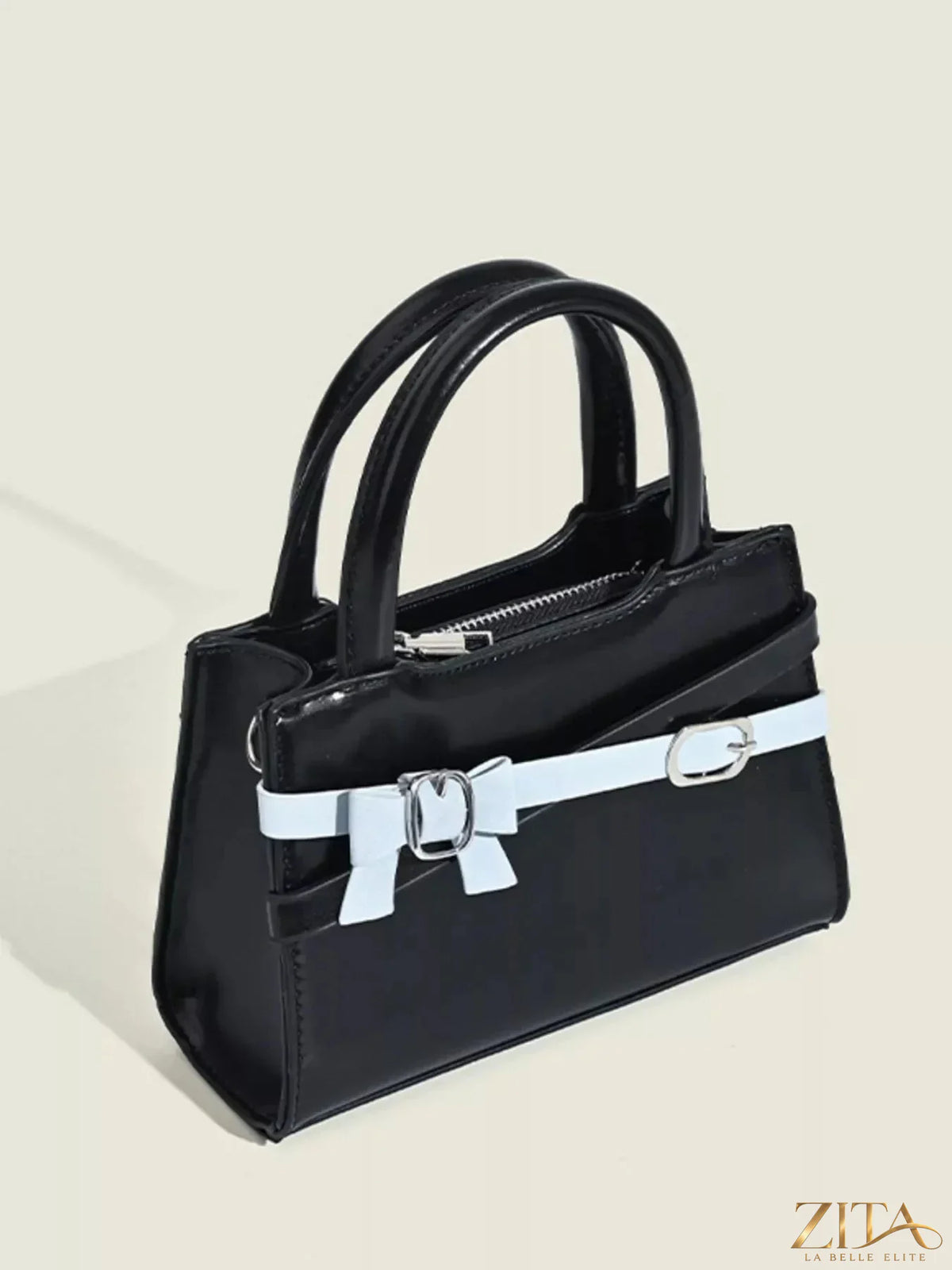 Zita La Belle Elite bow decor top handle handbag with elegant design and sleek black finish.
