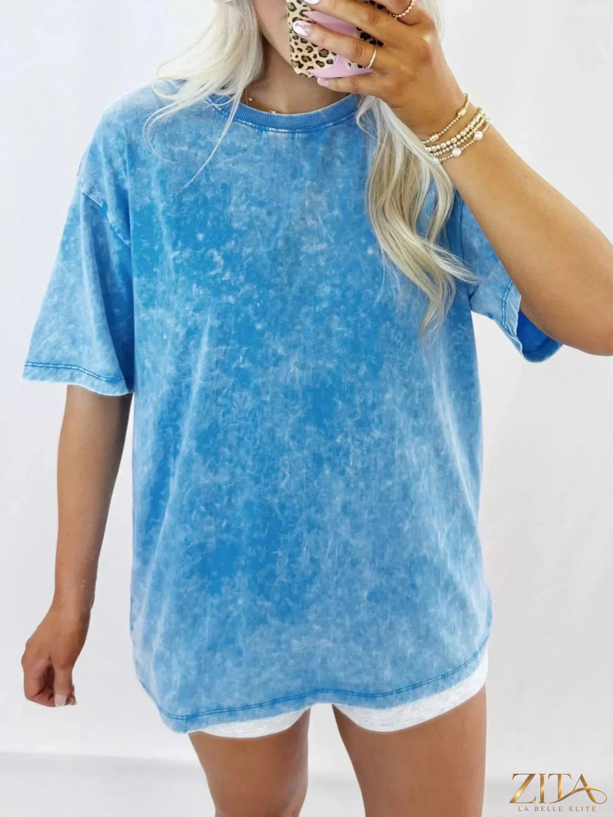 Mineral washed oversized tee in soft fabric, featuring a relaxed fit and trendy design by Trendsi.