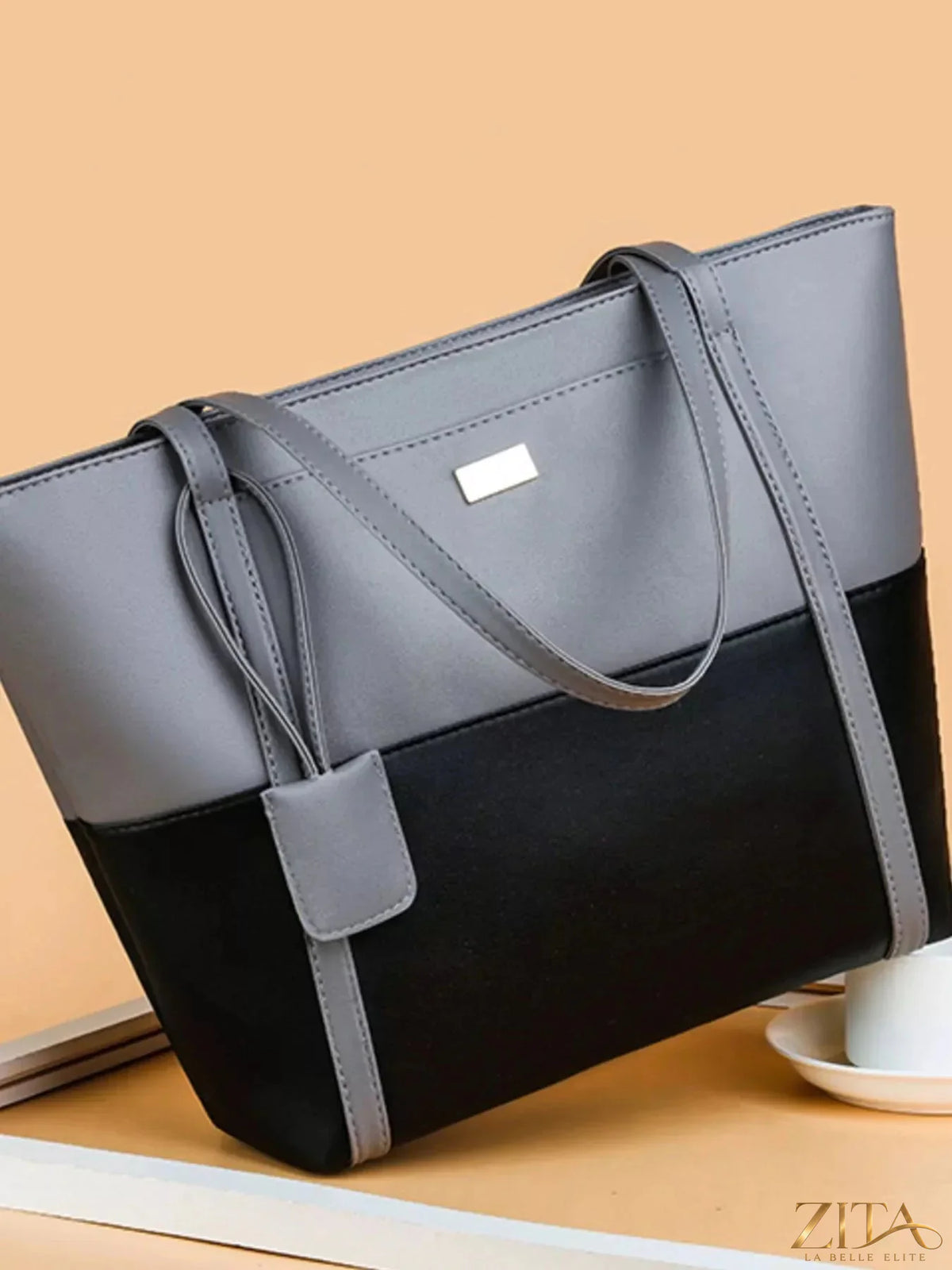 Two-tone tote bag by Zita La Belle Elite with spacious design and sturdy handles, featuring a stylish mix of colors.
