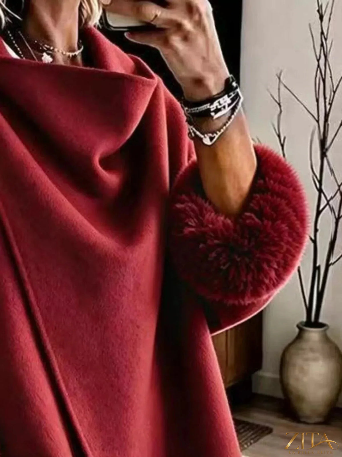 Plus size full-length outerwear by Zita La Belle Elite featuring elegant asymmetric faux fur cuffs and a stylish design.