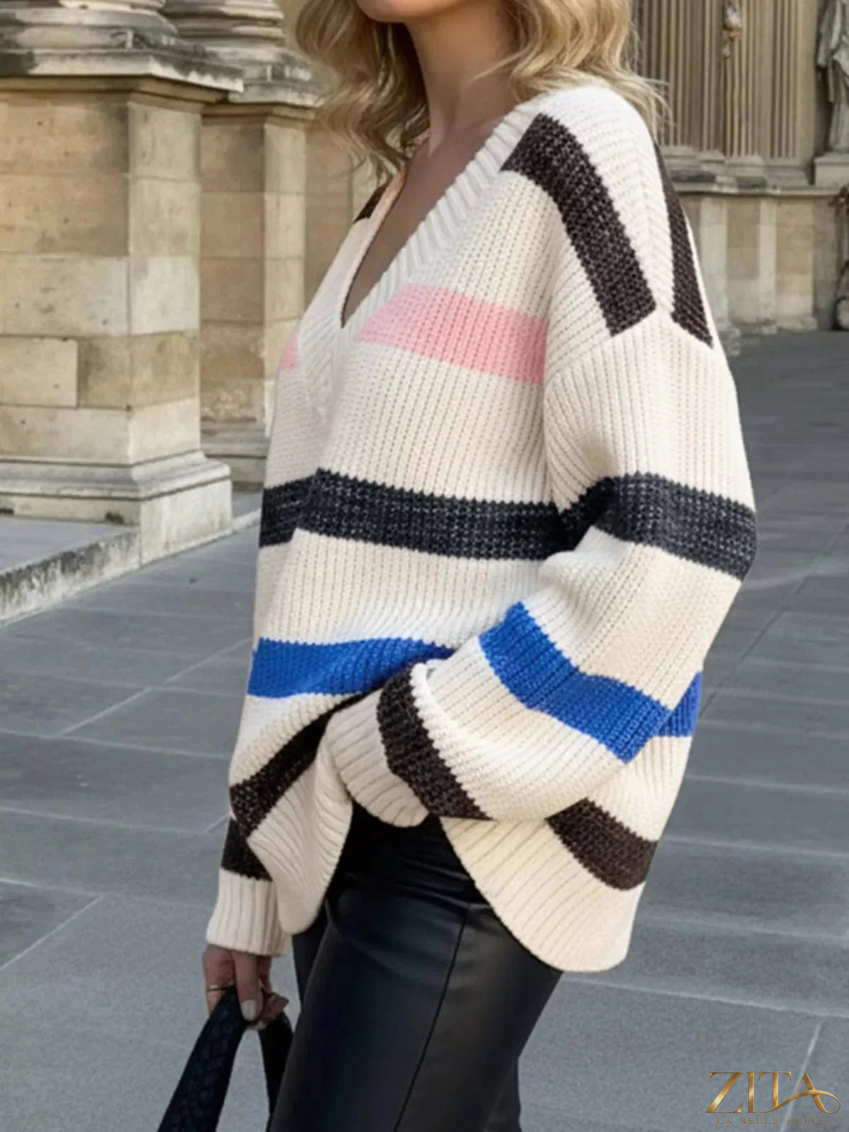 Striped V-neck oversized sweater by Trendsi, featuring bold horizontal stripes and a relaxed fit, shown in a cozy, casual style.