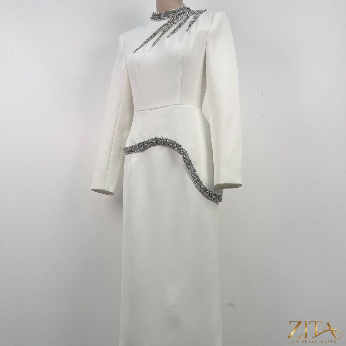 Crystal-embellished evening gown by Zita La Belle Elite featuring intricate crystal details and elegant flowing fabric.
