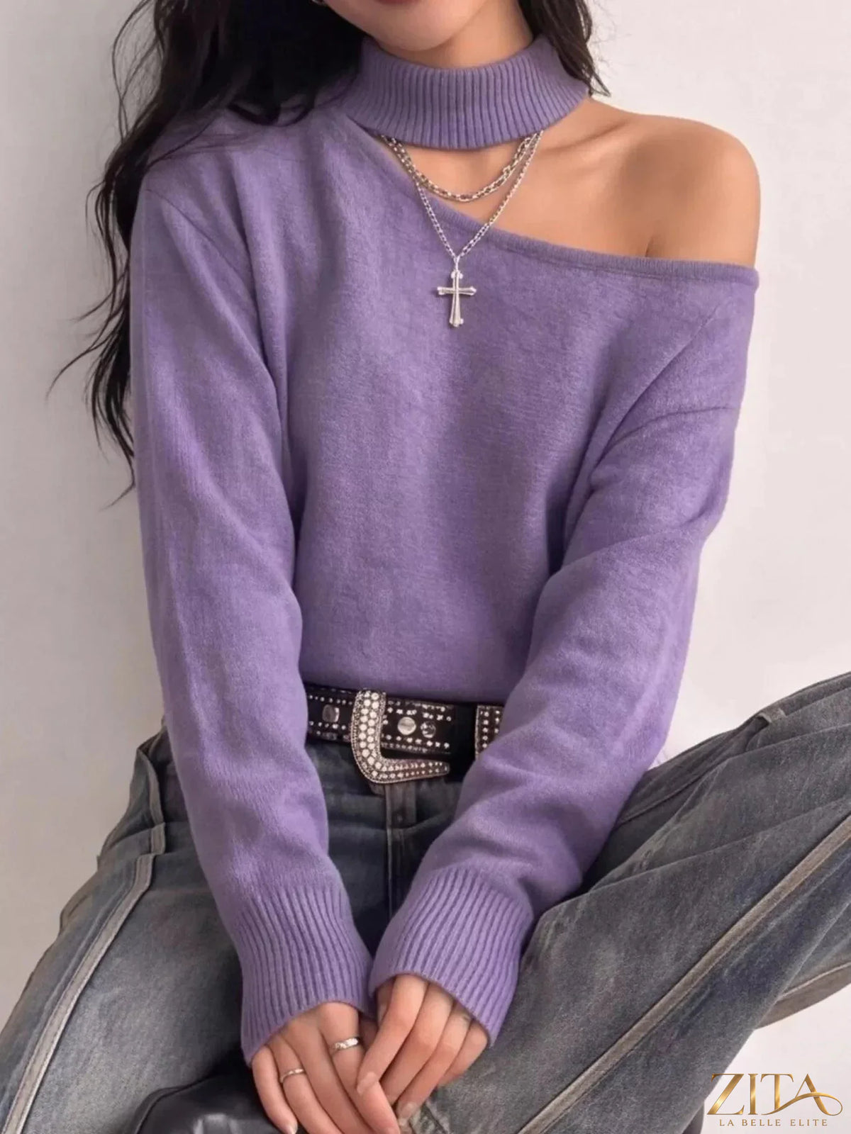 Cold-shoulder dropped shoulder sweater by Trendsi, featuring a cozy knit design with open-shoulder cutouts and relaxed fit.