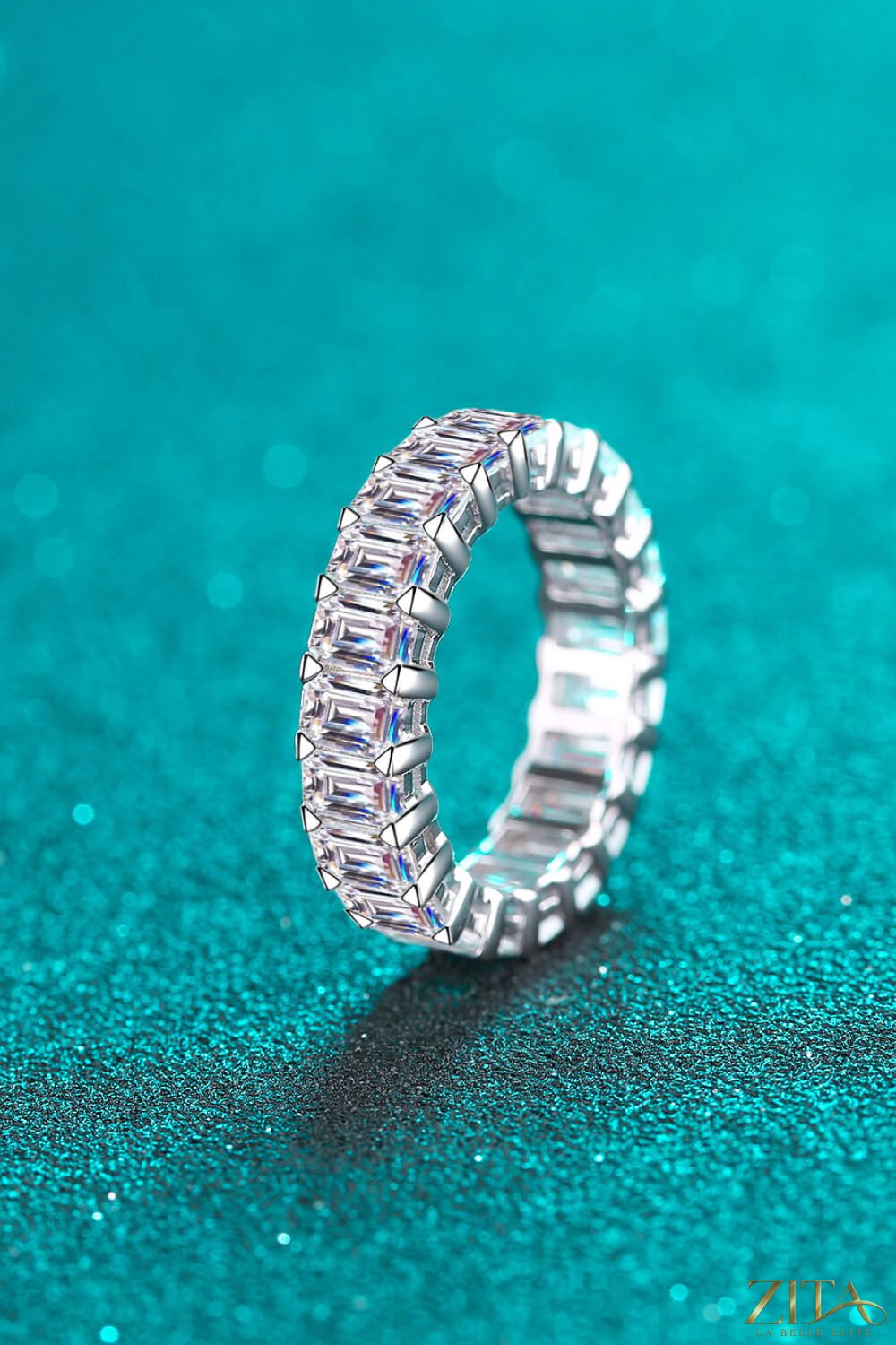 Rhodium-plated moissanite ring with 10.5 carats, featuring a sparkling central gemstone and intricate band design.