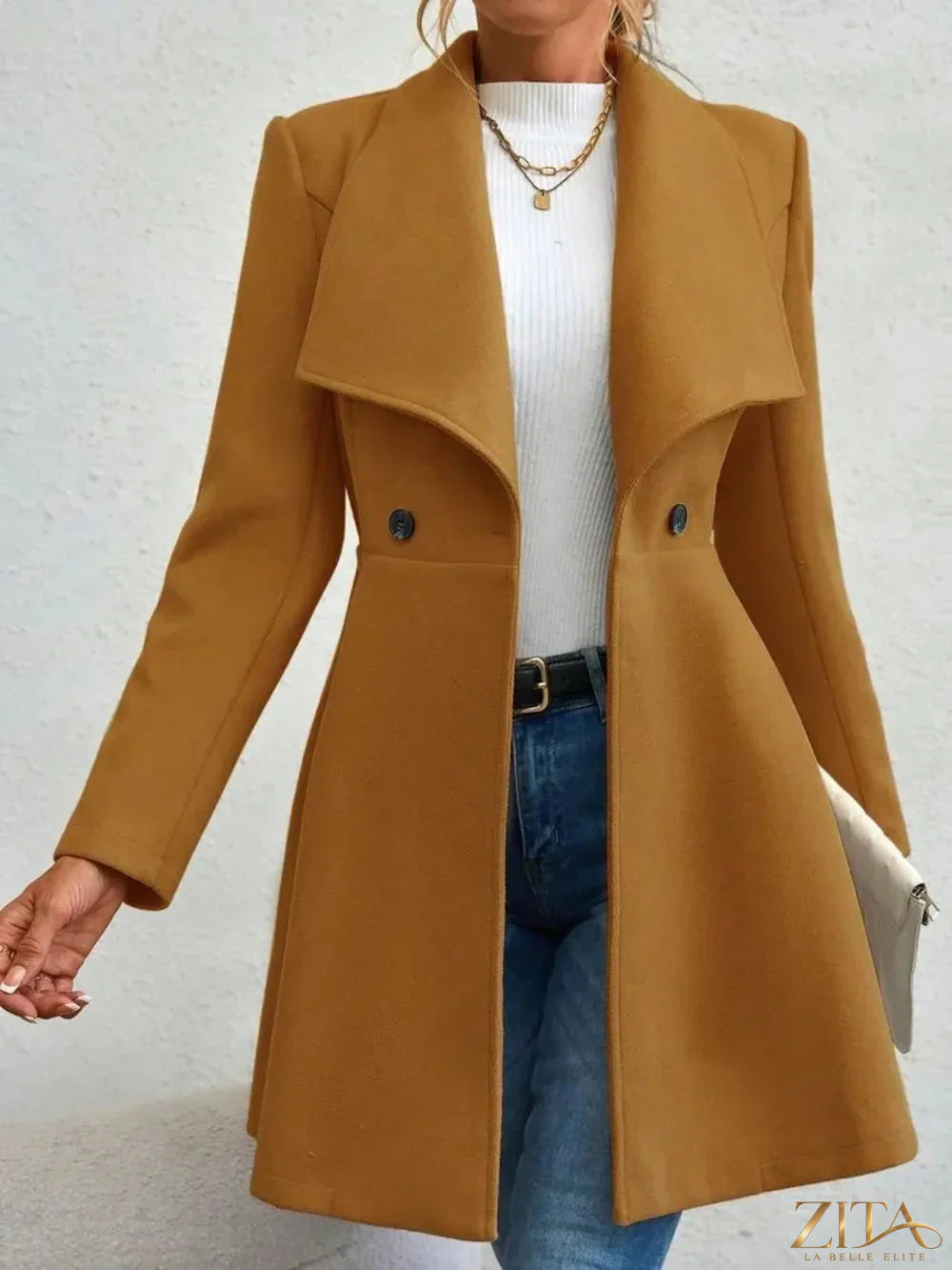 Zita La Belle Elite collared neck button-up long sleeve coat hanging on a rack, showcasing its classic design and tailored fit.