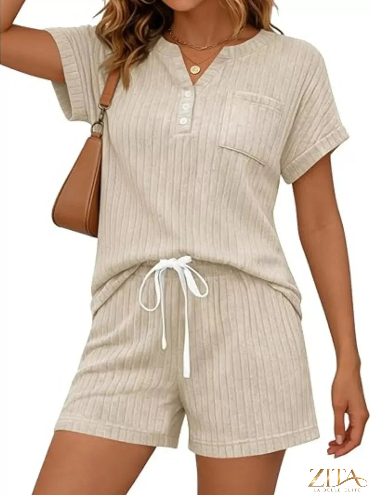 Casual ribbed knit tee and shorts set by Trendsi, featuring a comfortable, stylish matching top and shorts in soft fabric.