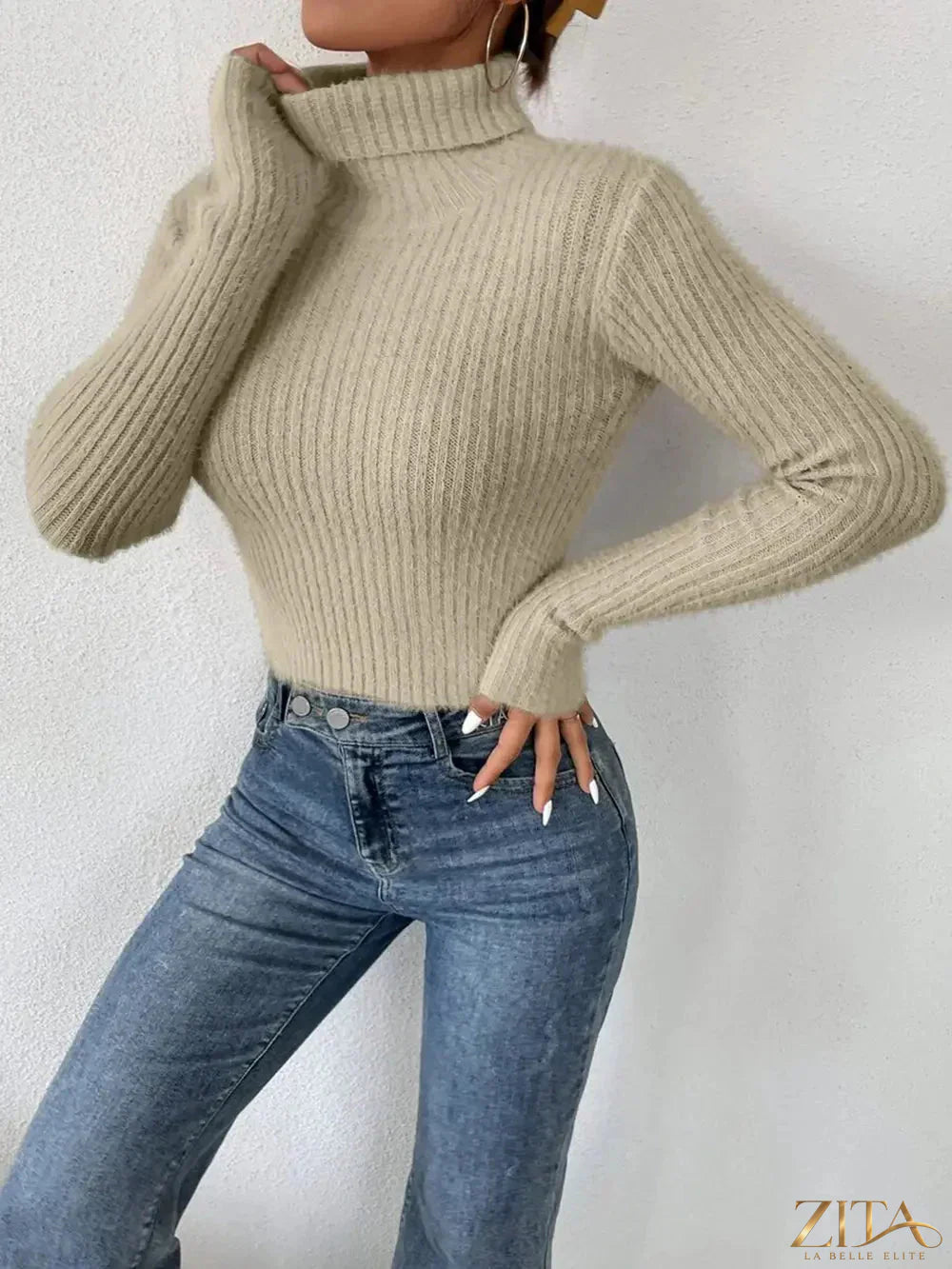 Ribbed turtleneck long sleeve sweater by Trendsi, featuring a fitted design and cozy ribbed fabric in neutral color.