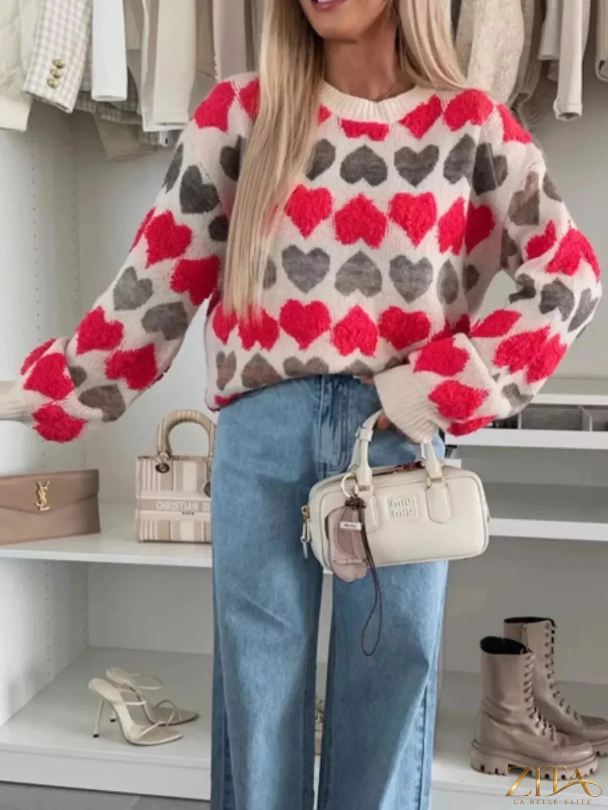 Heart-patterned round neck sweater by Zita La Belle Elite, featuring a cozy knit design with red and pink hearts on a soft fabric.