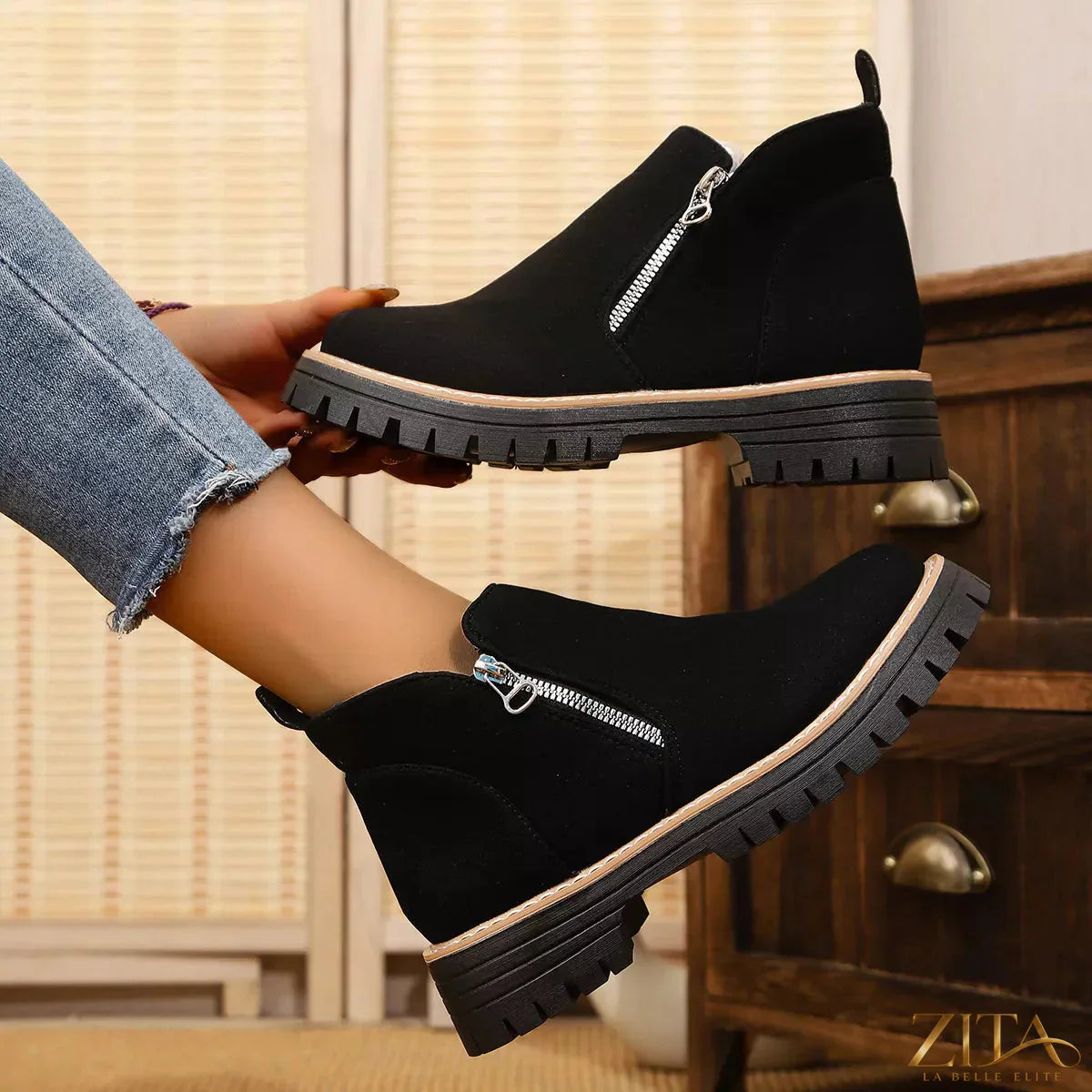 Zita La Belle Elite ankle boots with zipper accent, showcasing stylish black leather footwear with side zipper detail.